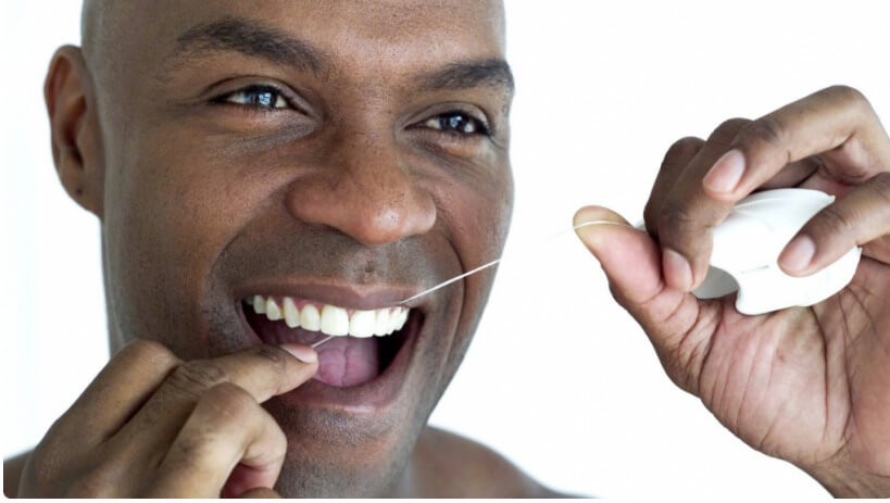 Man flossing with dental floss
