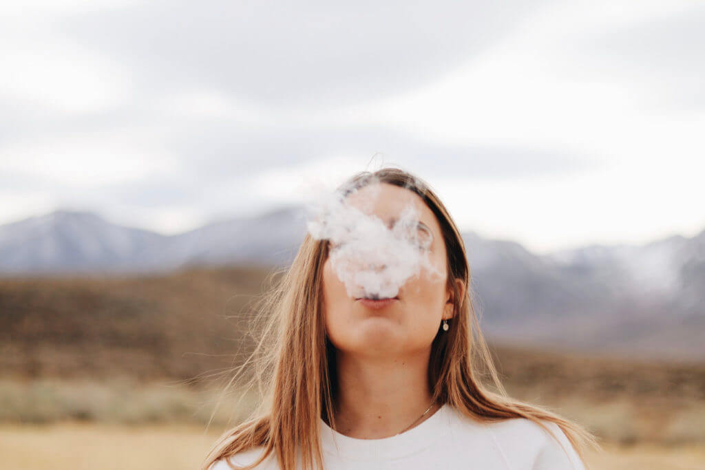 girl smoking with sore gums