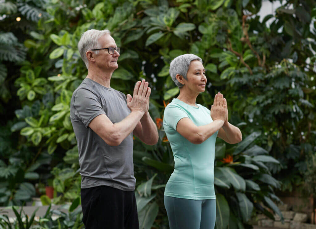 older couple doing yoga